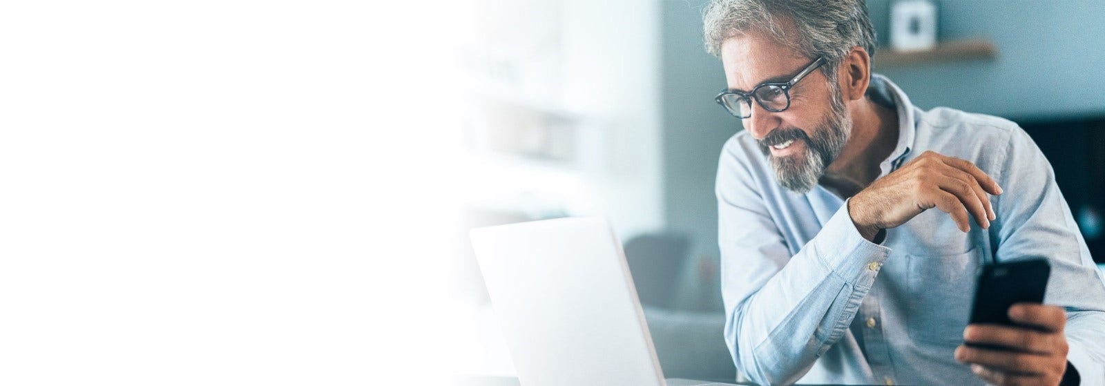 Bitdefender Premium Security promotional banner showing cross-device protection across laptop and phone screens