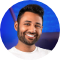 A person smiling at the camera AI-generated content may be incorrect.